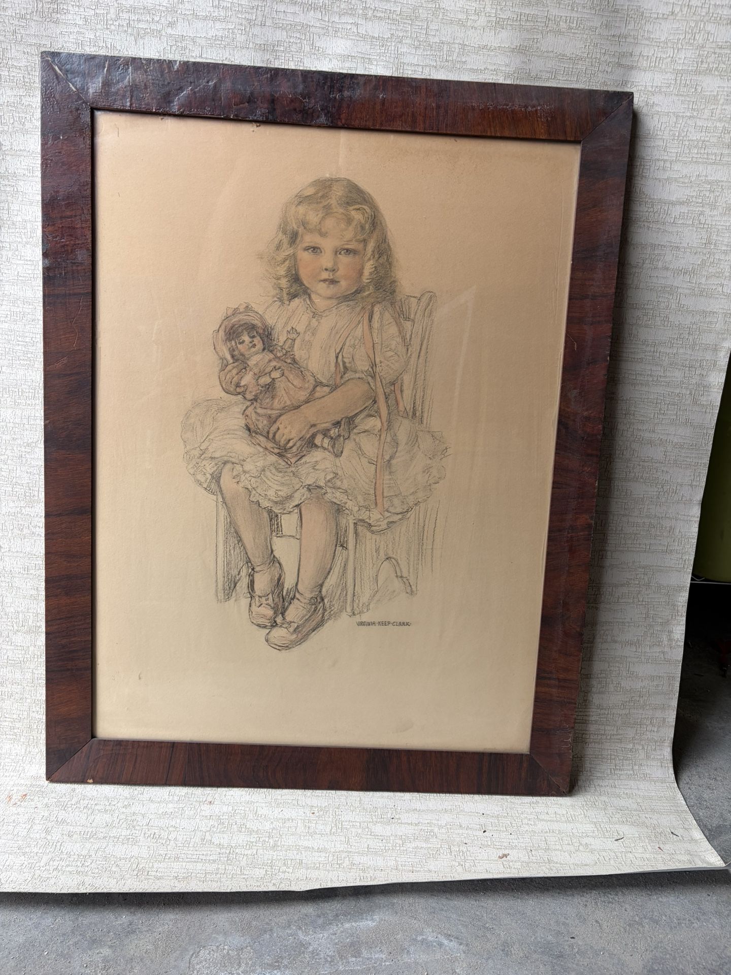 Portrait of a little girl with a doll, Virginia Keep Clark. A pencil drawing from the early 20th century depicts a blonde-haired girl in a voluptuous