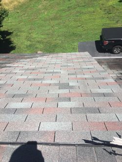 Power washing those black algae stains away from your shingles,decks,sidewalks,and siding and making your roof look like New!