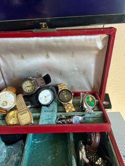 Assortment of Used and Broken watches.