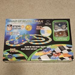 NEW IN BOX  Snap N' Glow Trax Light Speedway Set.
