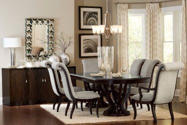 Sophisticated Style large dining set featuring featuring a distinct birdcage style base