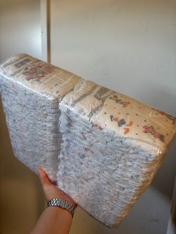 Size 2, two packs of sealed diapers Huggies