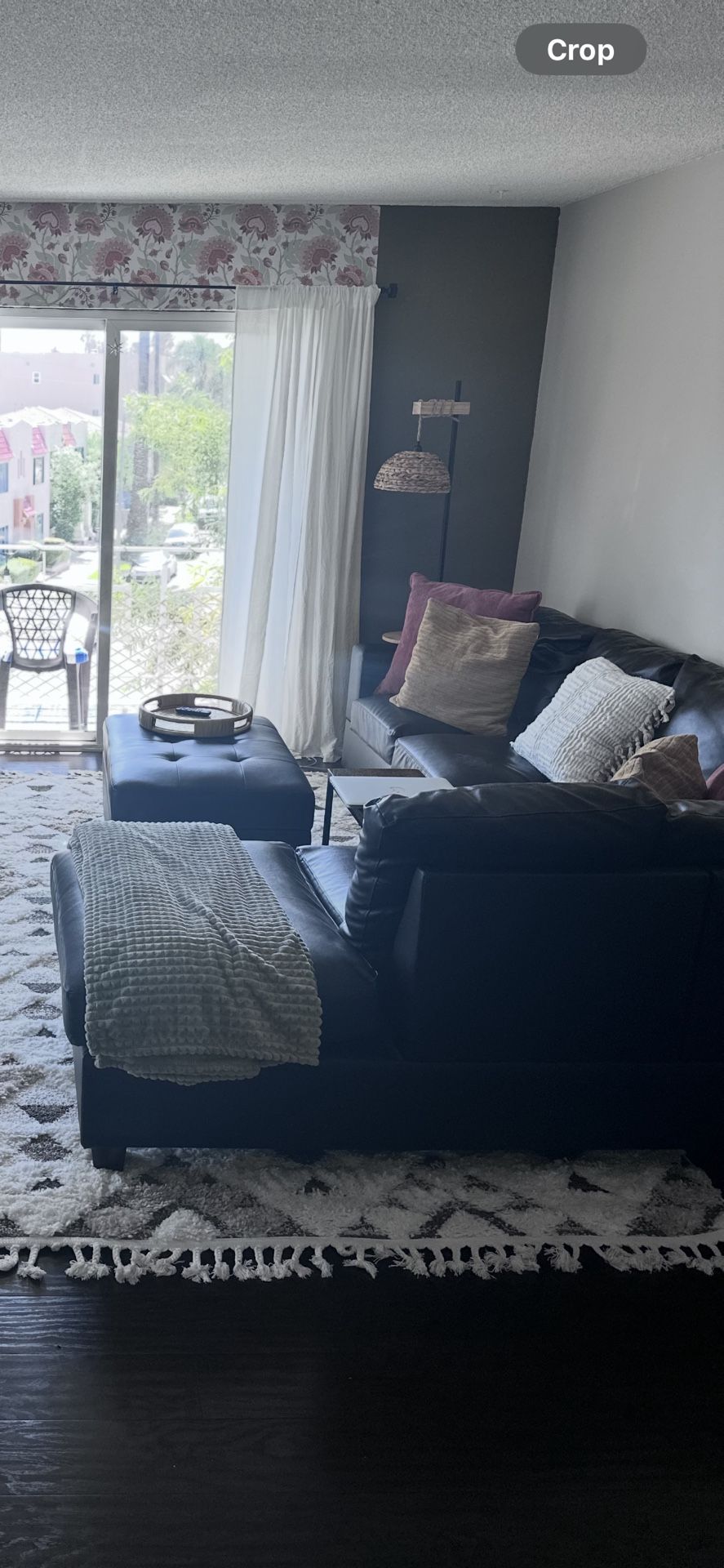 black leather sectional + ottoman