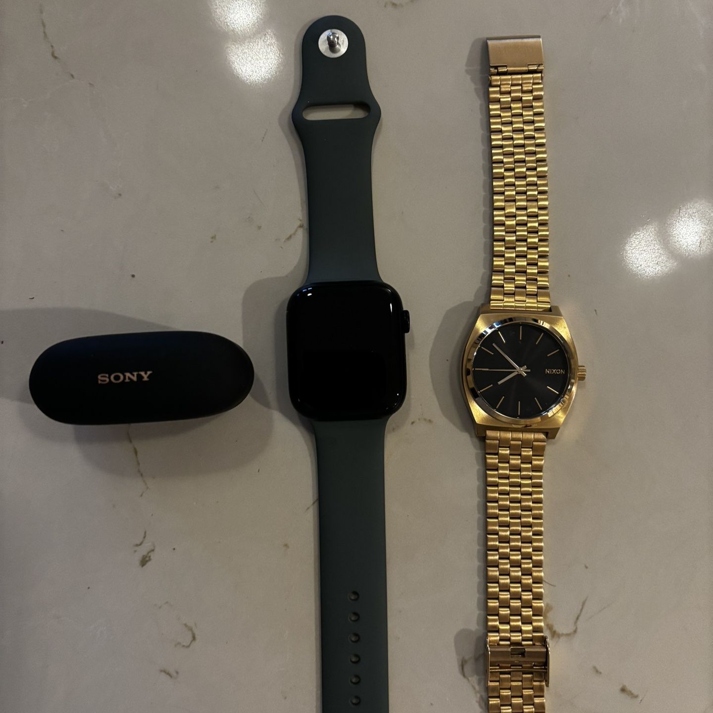 Apple Watch Series 8, Nixon Watch, Sony Ear Bud Combo