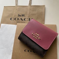 Coach small trifold Wallet in signature Canvas