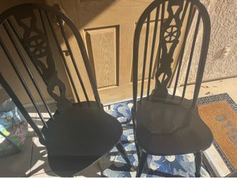 Pair of black Windsor style chairs