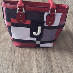 black, white, gray, purple pattern handbag and wallet