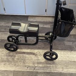 Foldable Knee Walker , It Is Adjustable Steerable With Brakes, Storage Bag, And Padding Extra- It Is Like New Used Very Little