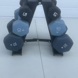 Dumbbell lot with stand 2-15s 2-10s and 2-5s. 5s has a tear in the rubber coating. 60lbs total. Location below   31705 SR-54  Wesley Chapel, FL  33545