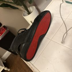 This is a Christian Louboutin Louis Orlando Flat Neo Black sneaker. 