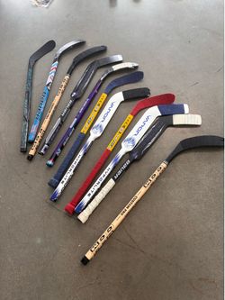 Mini Hockey Sticks With Pucks and Tape Bag