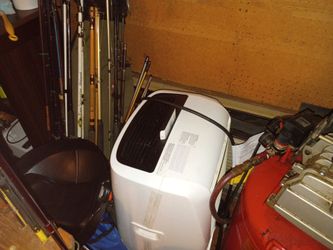 Penguin air conditioner floor unit hose runs out the window will cool 1500 square feet