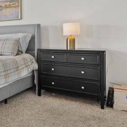 Spacious matching black side tables with Silver Hardware . Still available 