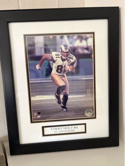 Torry Holt #81 St. Louis Rams Framed 8”x10” Photograph, frame is 16” x 13” Style# 1740869