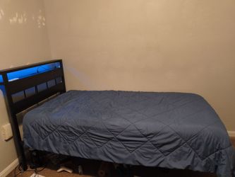 Twin bed with led light headboard