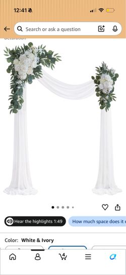 Wedding arbor drape and florals