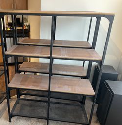 FJÄLLBO 2 Shelving units black, / wood measuring width 39 3/8x53 1/2 tall  An airy and stable shelving unit that is perfect when you want to create a 