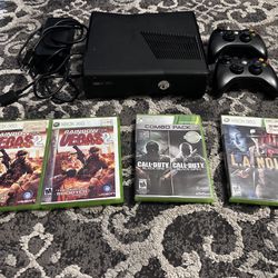 Xbox 360 S Model 1439 With Three Games, Two Controllers, And An AC Adapter