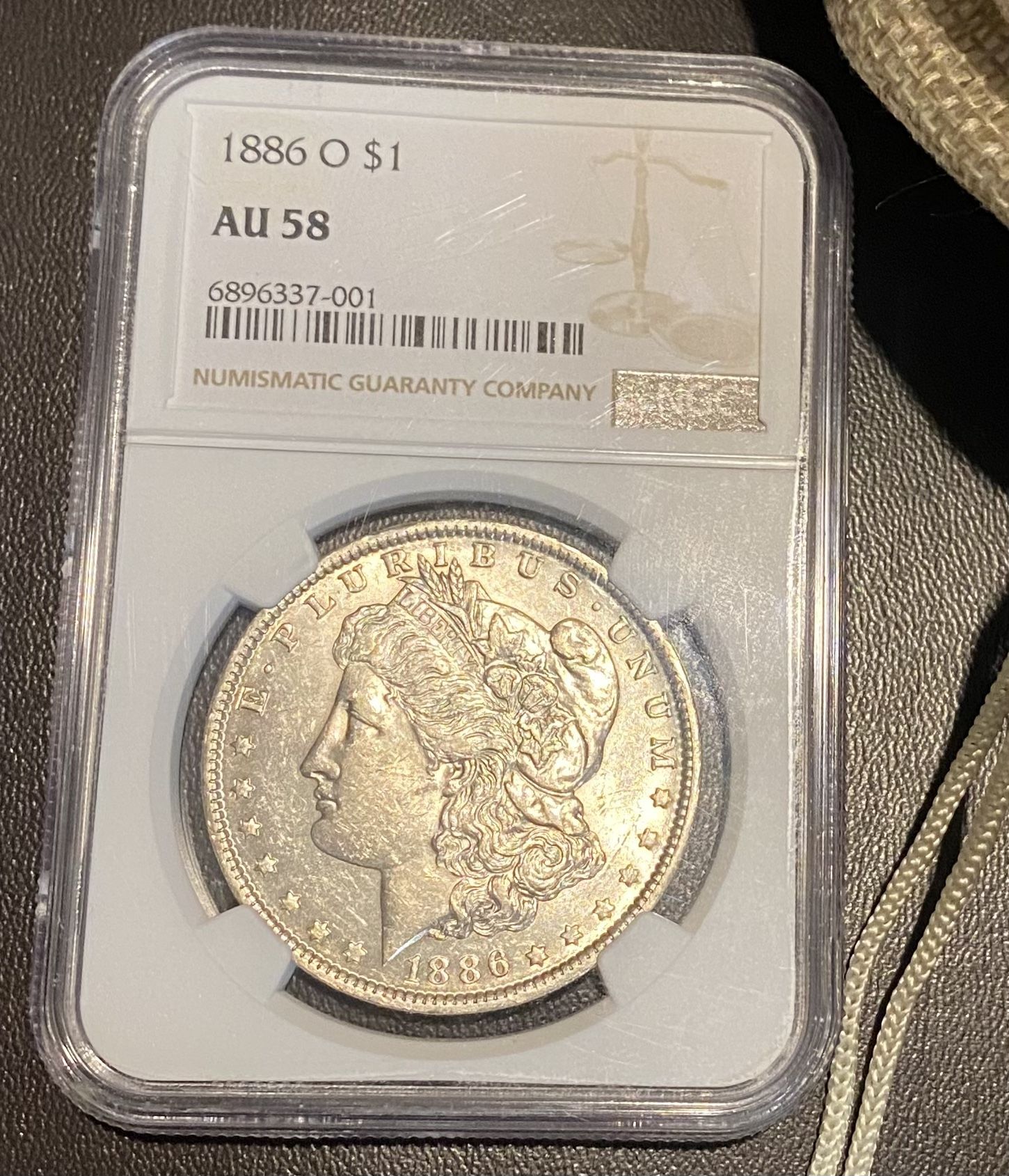 Morgan Dollar $1 1886-0 NGC AU58
