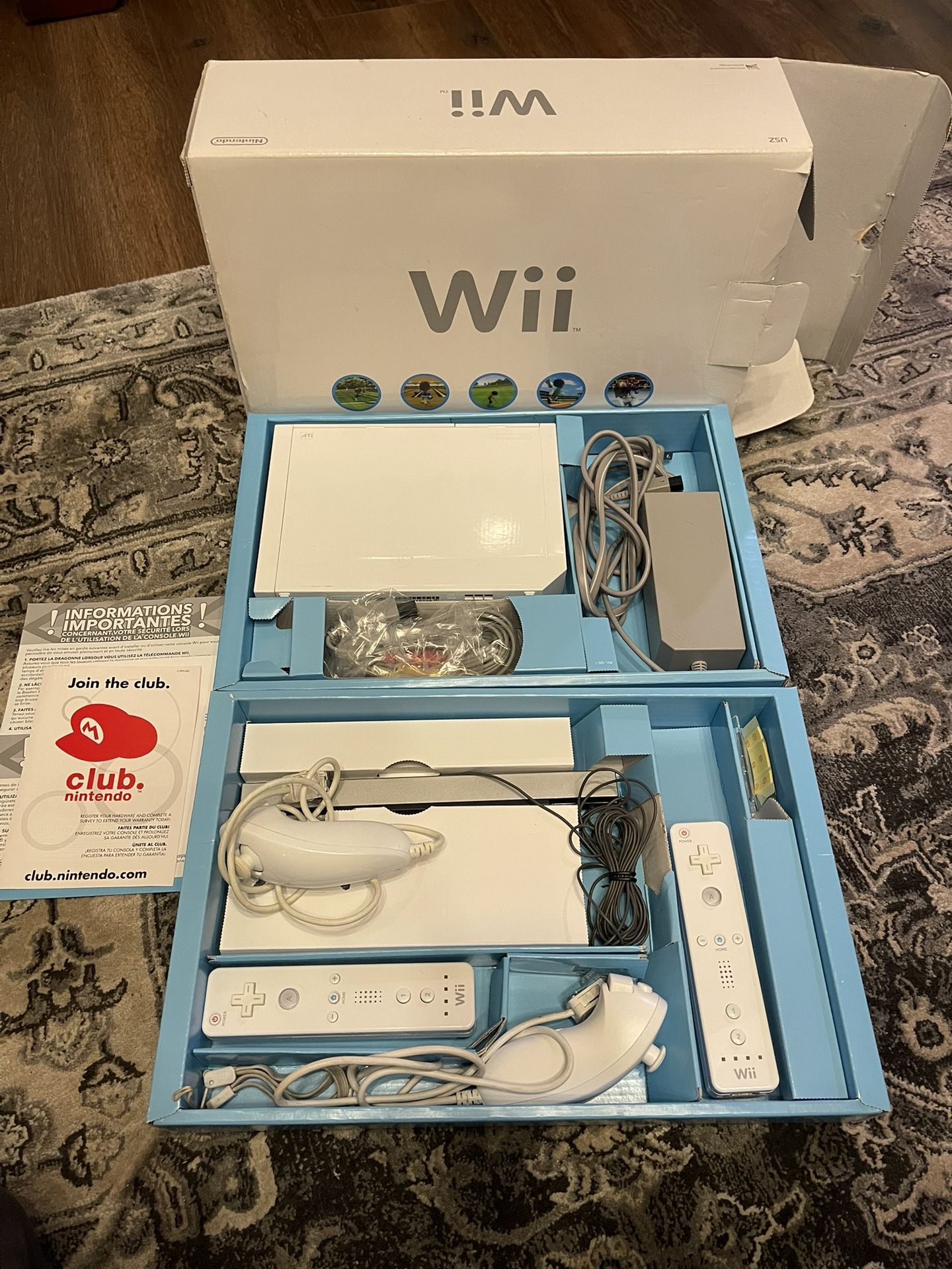 Nintendo Wii With Two Controllers And Two Nunchucks