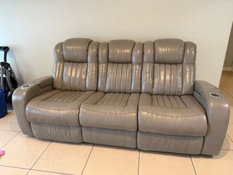 Beautiful 3-piece power reclining sofa set in taupe/gray.