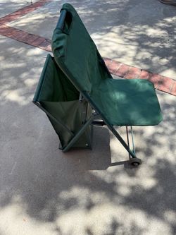 Green Folding Chair with Wheels must pick up now today or tomorrow