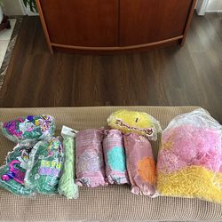 Lots of Easter egg basket stuffing grass