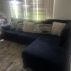 Sectional Couch with Rug and Pillows  