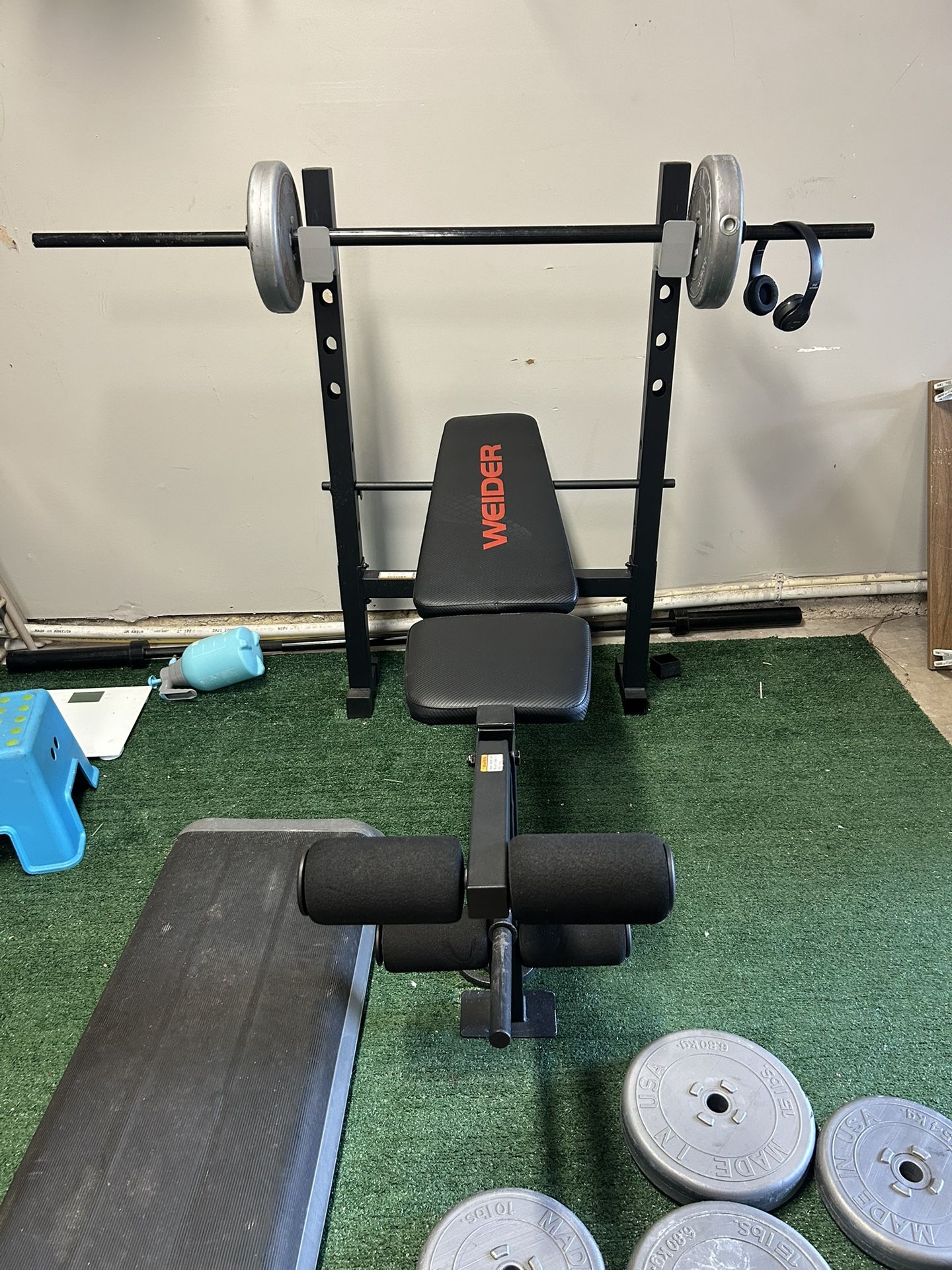 weight bench with a barbell rack