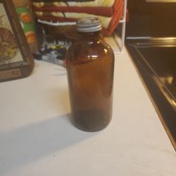 Vintage Mid 20th Century Brown Glass Bottle With A Screw Cap 