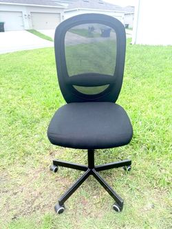 Selling a black swivel office chair with casters.