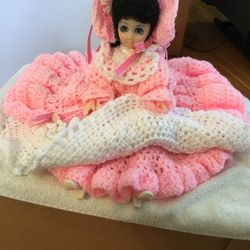 Vintage doll with flowing pink crocheted dress and bonnet 