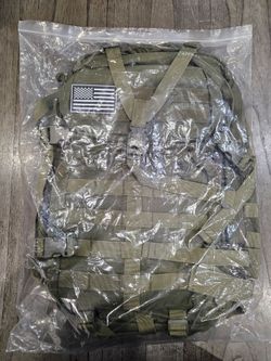 This is a USCCA military green tactical backpack featuring adjustable straps, multiple pockets, and MOLLE webbing