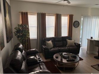 Brown Leather Sofa and loveseat (both power recline)