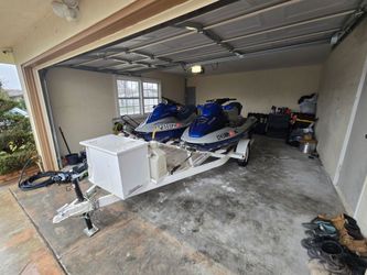 2001 bombardie. Blue and gray jet skis