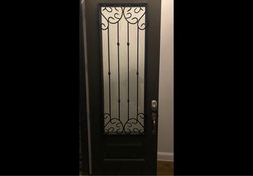 Entry Door with Iron Scrollwork Glass