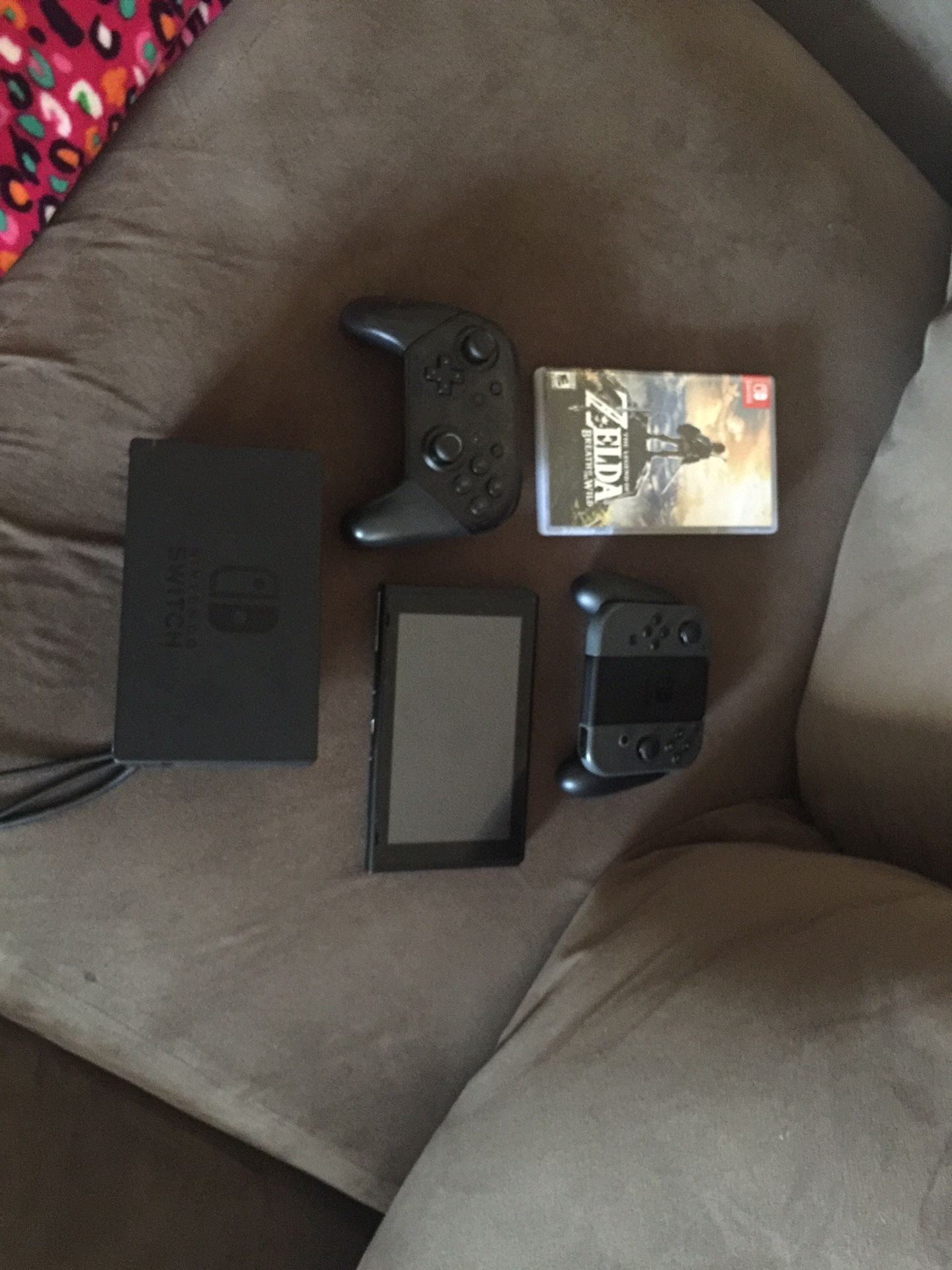 Nintendo switch and dock pro controller and legend of Zelda. More games on my account