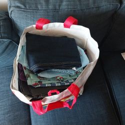 Bag Full Of Clothong And Accessories 