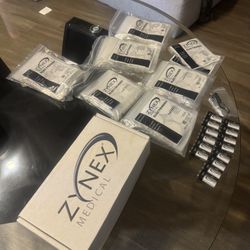 Brand new Zynex NexWave electrotherapy pain relief device, factory sealed and never opened.