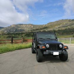 Jeep Wrangler TJ With Roof Rack Tires