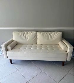 Cream Leather Tufted Sofa with Bolster Pillows