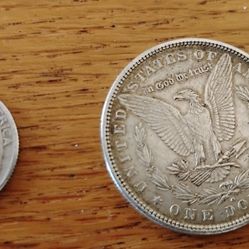 A Morgan Silver Dollar In 1963 Silver Quarter