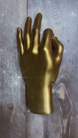 Golden hand sculpture- Okay