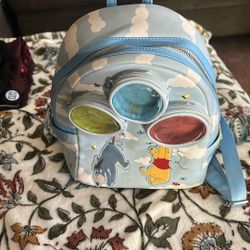 Winnie the Pooh in eager backpack used $20