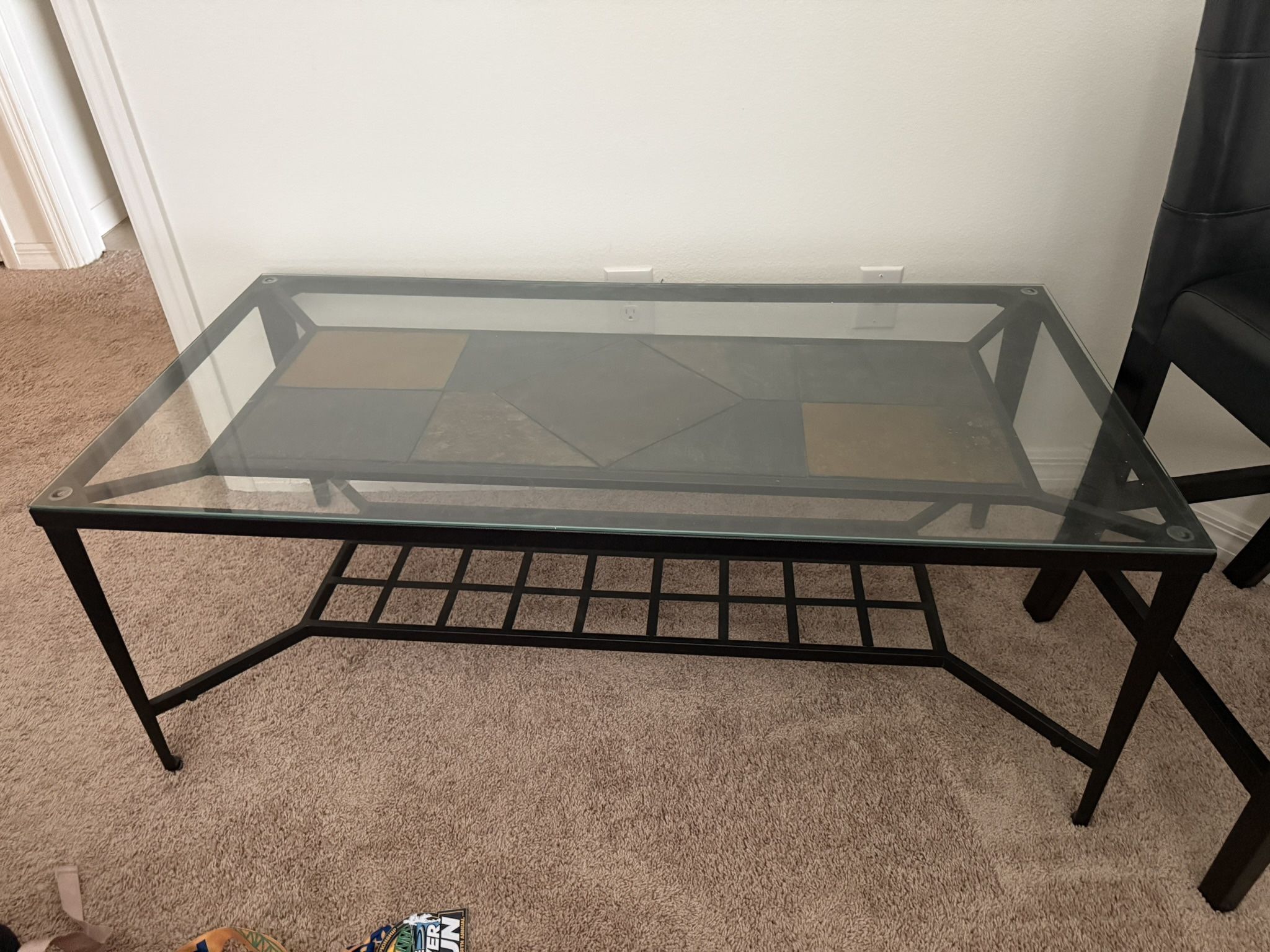 glass-top coffee table with a metal frame and a stone/tile inlay centerpiece