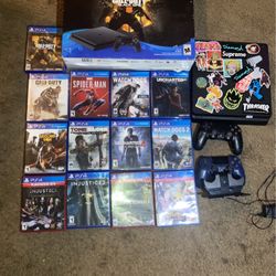 PlayStation 4 With Extra controller charging stand and games