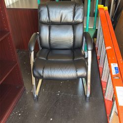 Two Black Leather Chairs 