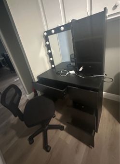 Black make up vanity with comfy chair