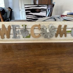 Welcome Sign, Basket With Black Teddy Bear