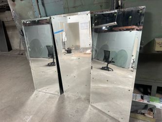 Glass cylinders, countertop, circles, and mirrors